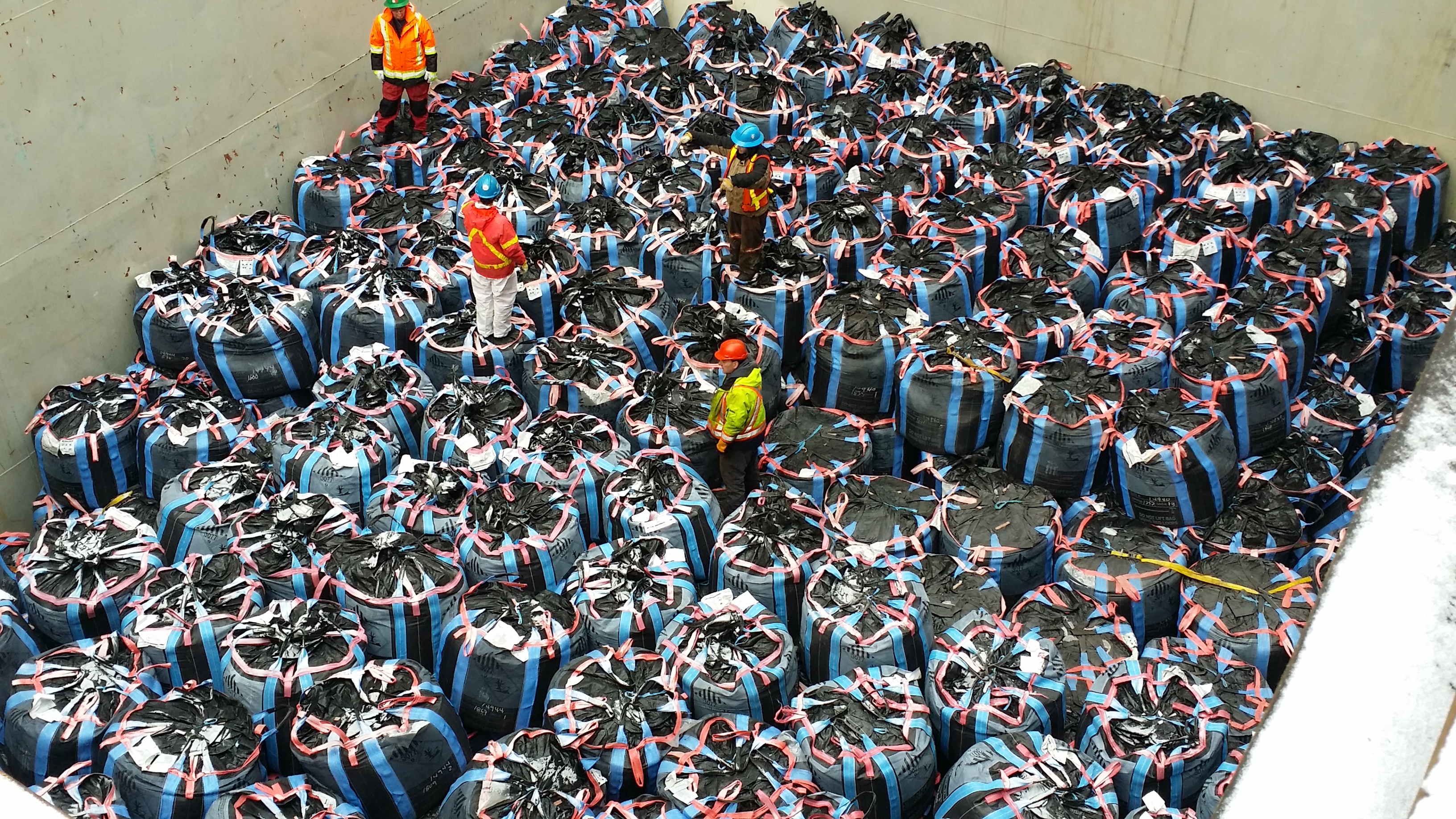 Bulk bags for mining and metal processing. The hull of a cargo ship filled with bags. Bulk bags for mining and metal processing. The hull of a cargo ship filled with bags.